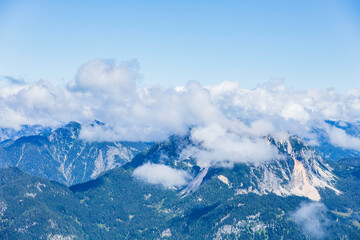 Panoramic view of mountain peaks in the clouds