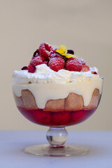 Raspberry trifle with fruit jelly, custard and cream