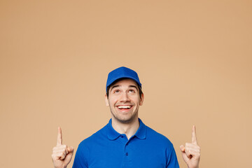 Fun delivery guy employee man wearing blue cap t-shirt uniform workwear work as dealer courier...