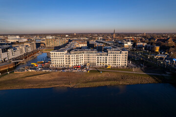 Luxury residential Kade Zuid apartment complex construction at riverbank of river IJssel reflecting...