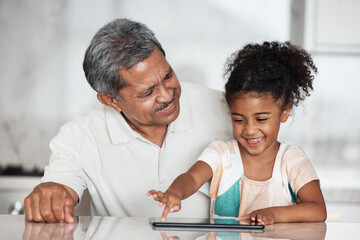 Learning, grandfather and girl with tablet in home, playing online games or educational app. Family bonding, touchscreen or care of happy grandpa teaching child how to use digital technology in house
