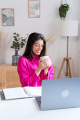 Smiling woman with cup of coffee