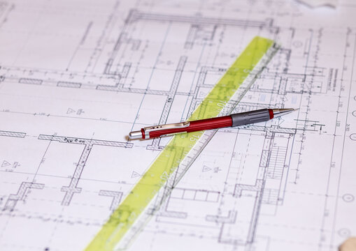 Architect workplace top view. Architectural project, blueprints, blueprint rolls on table. Industry, hobby, workspace. Creation process © mitsyko1971