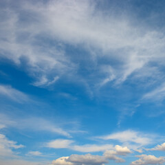 Beautiful white fluffy clouds against blue sky.