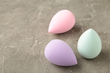 Beauty blender on a grey background. Bright sponges for make-up cosmetics. Makeup products. Beauty concept.