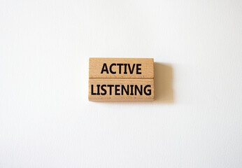Active listening symbol. Wooden blocks with words Active listening. Beautiful white background. Business and Active listening concept. Copy space.