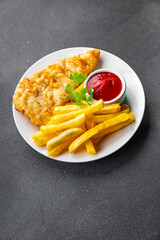 fish and chips french fries deep fried fast food takeaway healthy meal food snack on the table copy...