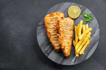 fish and chips french fries deep fried fast food takeaway healthy meal food snack on the table copy...