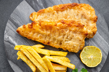 fish and chips french fries deep fried fast food takeaway healthy meal food snack on the table copy space food background rustic top view