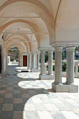 Columns and arches on the courtyard of the Byzantine Church of Agia Triada in Lefkes on Paros...