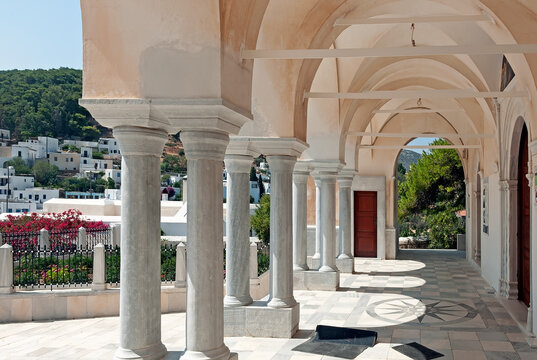 Columns and arches on the courtyard of the Byzantine Church of Agia Triada in Lefkes on Paros Island, Cyclades, Greece
