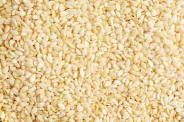 Closeup of lots of white sesame seeds. Sesame seeds background.