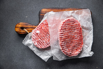 meat cutlet frozen minced meat pork, beef, chicken semifinished meal food snack on the table copy...