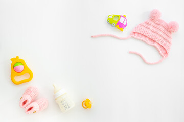 Obraz na płótnie Canvas Baby newborn hat with kids toys and accessories, top view
