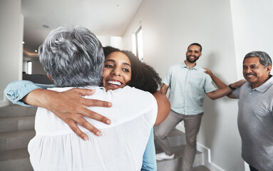 Family, hug or visit with a woman and senior mother hugging in a home together during a reunion. Love, bonding and happy with a mature female hugging her adult daughter while visiting in a home