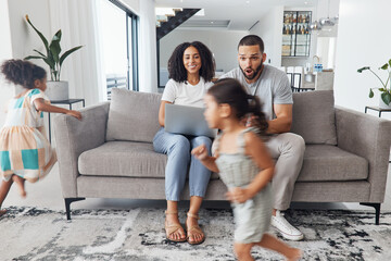Black family home, children and running in living room for game, bonding or funny time with parents on sofa. Kids, mother and father on lounge couch with laptop, smile and happiness for love together