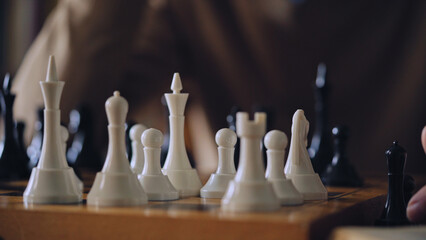 Man playing chess, thinking about game strategy or winning combination, hobby