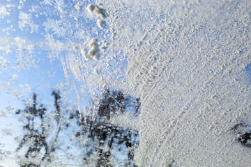 Frost and snow on the glass