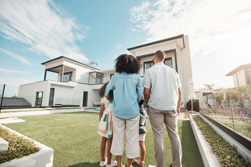 Love, new house and family in their backyard together looking at their property or luxury real estate. Embrace, mortgage and parents with their children on grass at their home or mansion in Canada. - obrazy, fototapety, plakaty