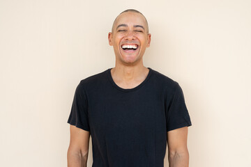 Portrait of handsome bald man laughing - 569903670