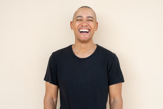 Portrait of handsome bald man laughing