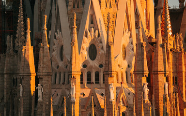 View of Barcelona Eixample residential district and Sagrada Familia Basilica at sunrise or sunset....