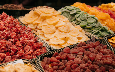 Spains one of the oldest market- La Boqueria. Massive stall full of different dryd fruits and nuts. Healthy snack stall full of different dryd goods. Diet snacks market.