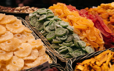 Spains one of the oldest market- La Boqueria. Massive stall full of different dryd fruits and nuts. Healthy snack stall full of different dryd goods. Diet snacks market.
