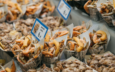 BARCELONA, SPAIN: 5.2.2023: - Fried little fish in the market The Mercat de Sant Josep de la Boqueria
