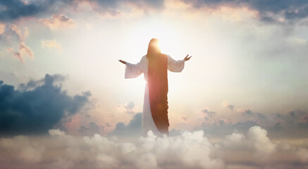 The resurrected Jesus Christ ascending to heaven above the bright light sky and clouds and God,...