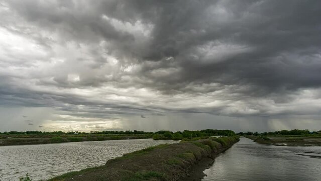Rain clouds is black and streams of rain descending into the well.