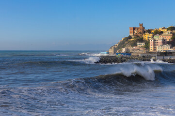 Fototapeta na wymiar GENOA, ITALY, JANUARY 18, 2023 - Rough sea on the beach of Genoa Sturla, Italy.