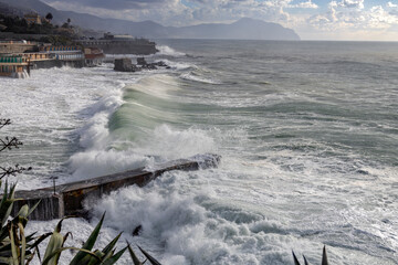 Rough sea and sky with clouds on the beach of Genoa Quinto, Italy