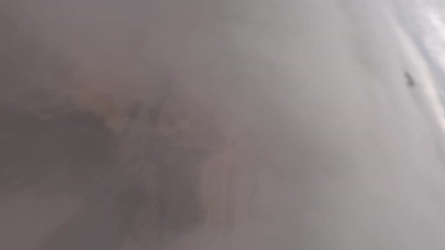 Dynamic Aerial fpv shot falling from the cloud at Bardenas Reales desert