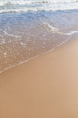 Fototapeta na wymiar Ocean waves on a sandy beach