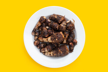 Organic taro fruit in white plate