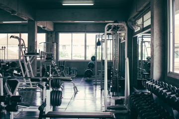 Naklejka na ściany i meble Background of fitness gym with bodybuilding station