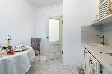 Corridor in with white walls and doors in the apartment