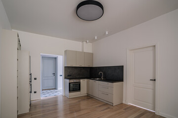 White and brown modern kitchen with wooden island