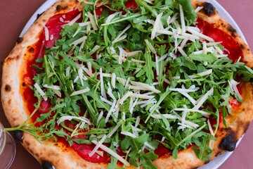 Italian pizza with prosciutto crudo and rucola
