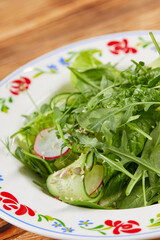 green salad on the wooden table