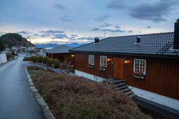 Fototapeta na wymiar Alesund's Red House: A Morning Scene to Savor