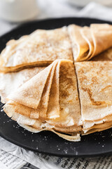 pancakes with butter on a white background with ingredients flour sugar butter