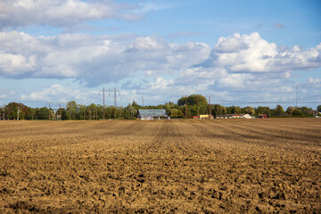 Fototapeta na wymiar Fresh soil in farmland field during early autumn in Skåne Sweden