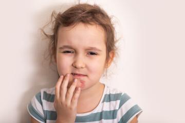 Wounds, scratches, abrasions on the kid girl skin face.