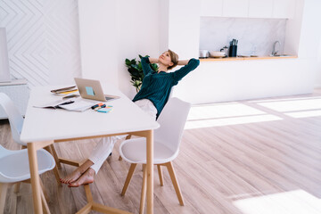 Woman leaning on back of chair during break