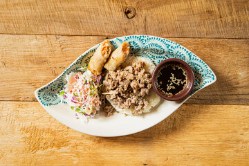 Fototapeta na wymiar Thai-style meat stir-fry rice bowl 
