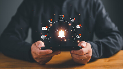 Business people using smartphone with virtual bell ringing for application notification alert concept, New email, digital marketing, electronic message alert.