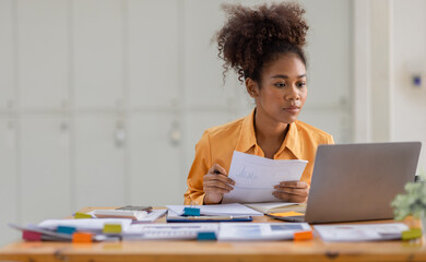 Attractive african young confident businesswoman Accounting using calculating income-expenditure and analyzing real estate investment data report Financial and tax systems concept.