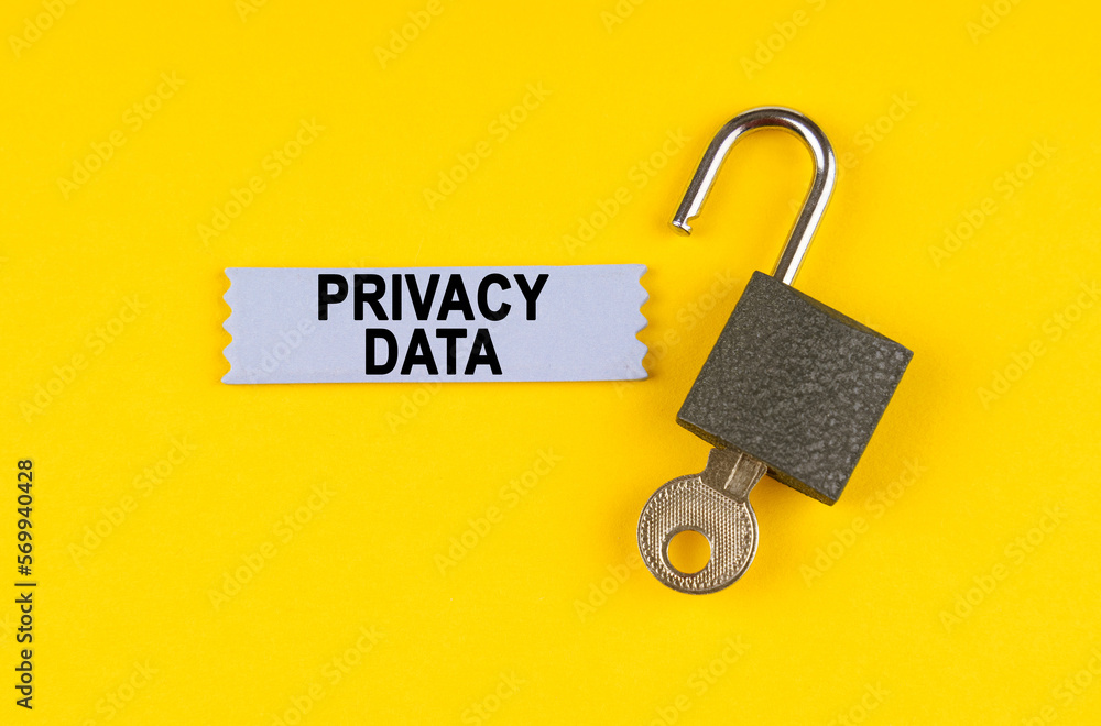 Poster on the yellow surface lies an open lock with a key, next to it is a sticker with the inscription - p